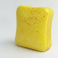 Butter toast squishy yellow with red speckles - front