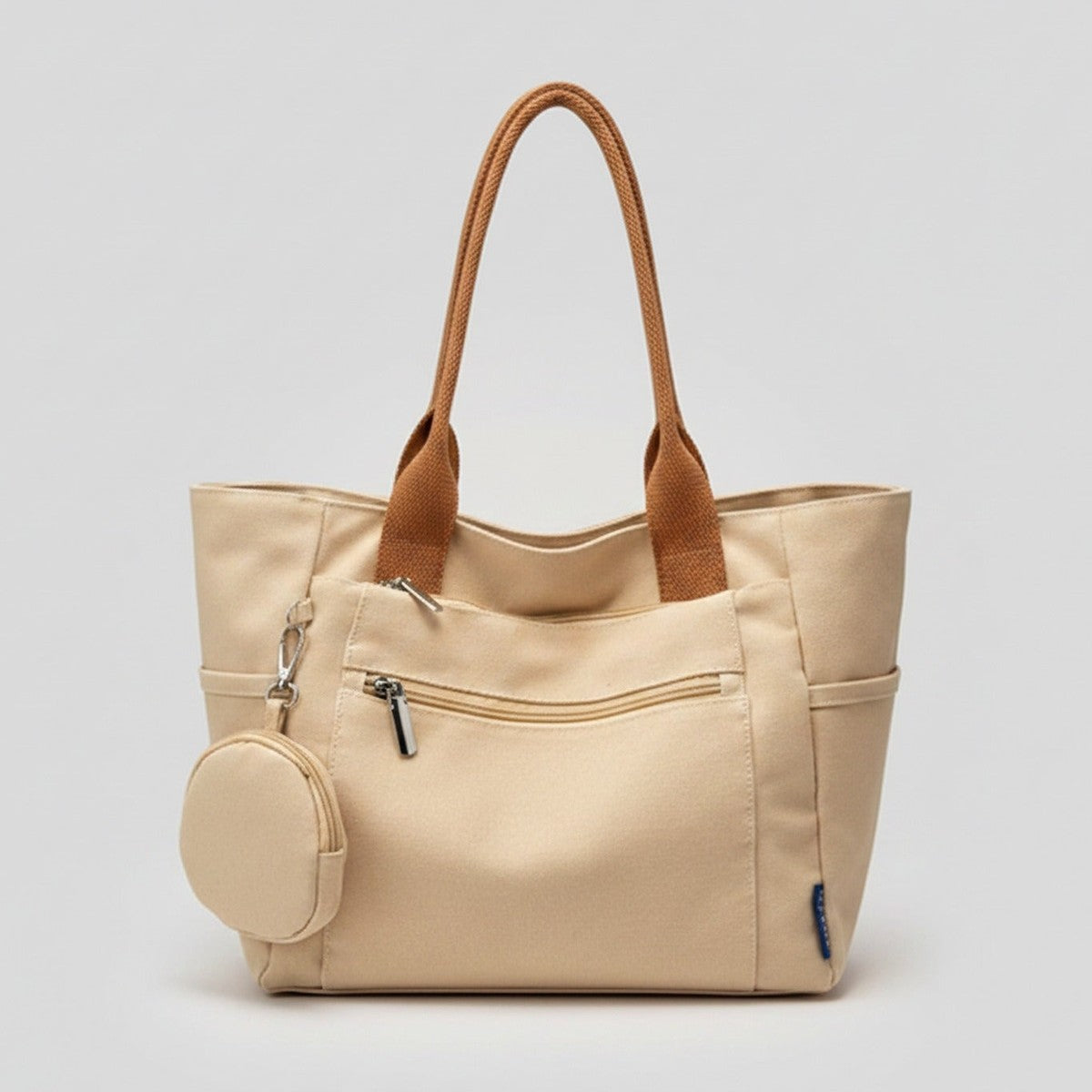 Cream Canvas Tote Bag With Circular Charm – bags & wallets (view 1)
