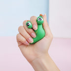 Green Googly-Eyed Alien Desk Toy - squeeze in hand