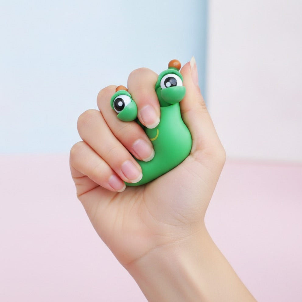 Green Googly-Eyed Alien Desk Toy - squeeze in hand