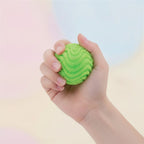 Smiley Face Spiky Squeeze Ball - Blue - squeeze in hand
