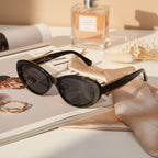 Black Oval Sunglasses With Gold Chain Arms