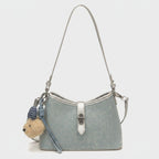 I notice this is a shoulder bag with a teddy bear charm, not a hat or cap. Based on the actual product shown, here's an