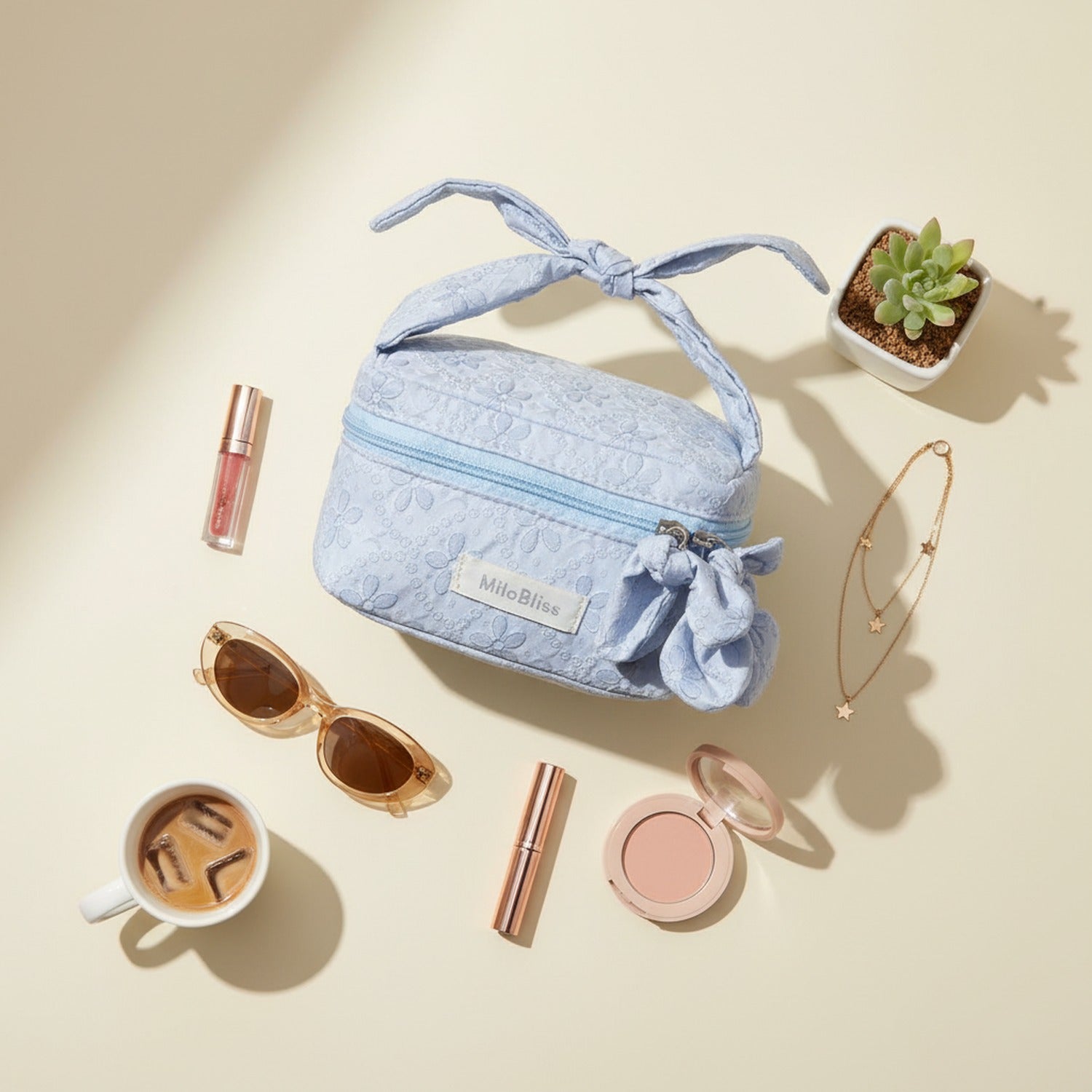 Quilted Light Blue Cosmetic Bag With Bow Charm
