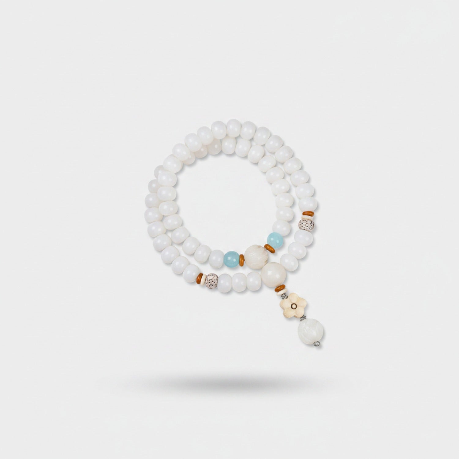 White Beaded Bracelet With Aqua Charm