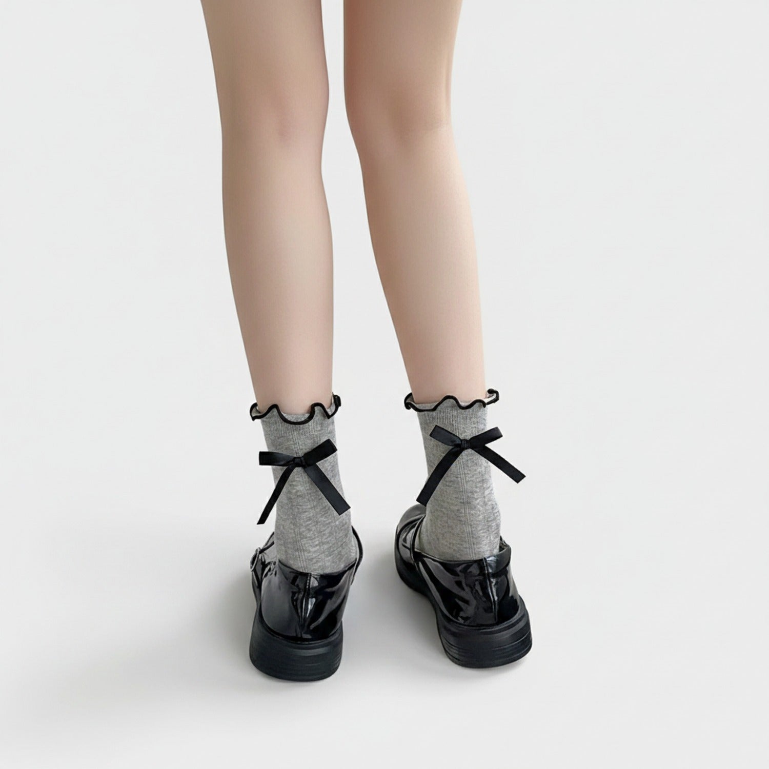Cream Ribbed Knee High Socks With Black Bows