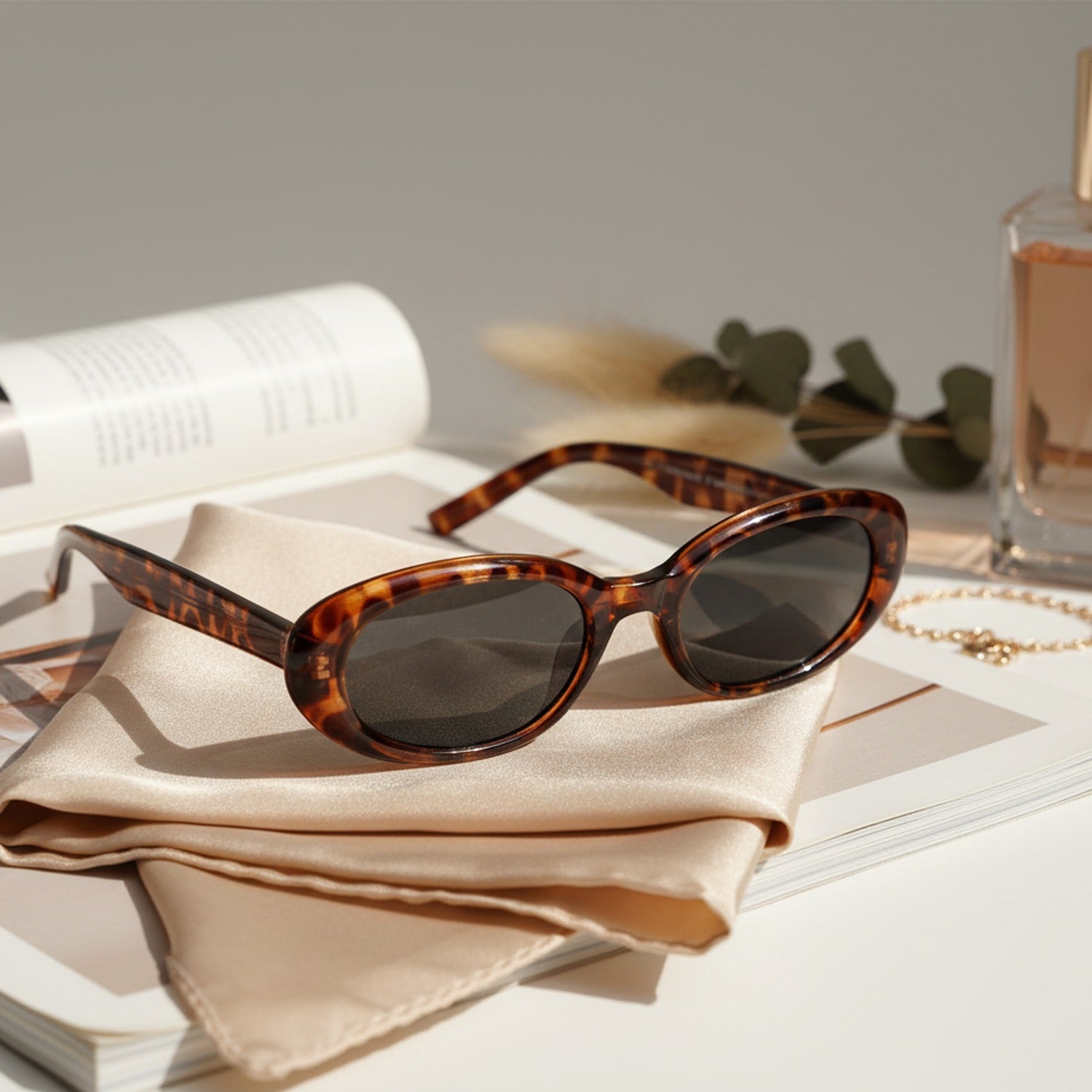 Black Oval Sunglasses with Dark Tinted Lenses