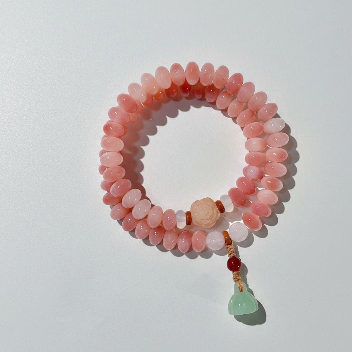 Pink Jade Beaded Bracelet With Green Jade Charm – jewelry (view 1)