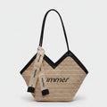Beige Straw Tote Bag With Black Handles And Ribbon Charm