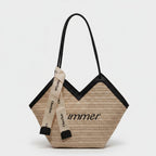Beige Straw Tote Bag With Black Handles And Ribbon Charm
