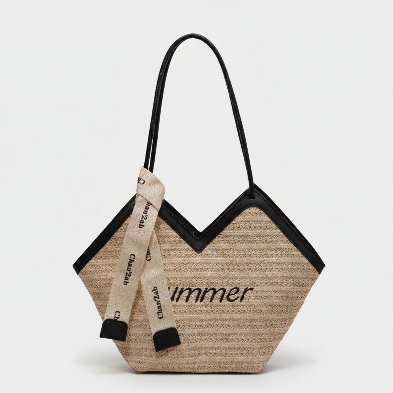 Beige Straw Tote Bag With Black Handles And Ribbon Charm