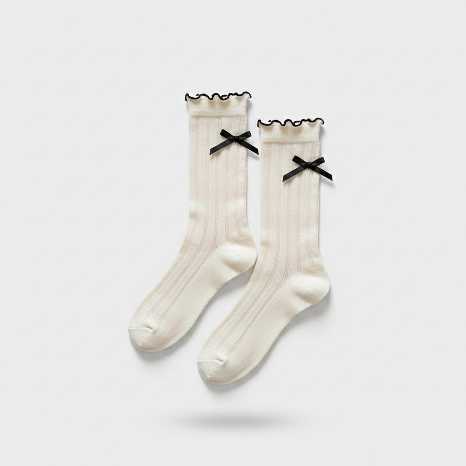 Cream Ribbed Knee High Socks With Black Bows