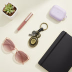 Vintage Brass Oval Charm Keyring With Black Leather Wrap