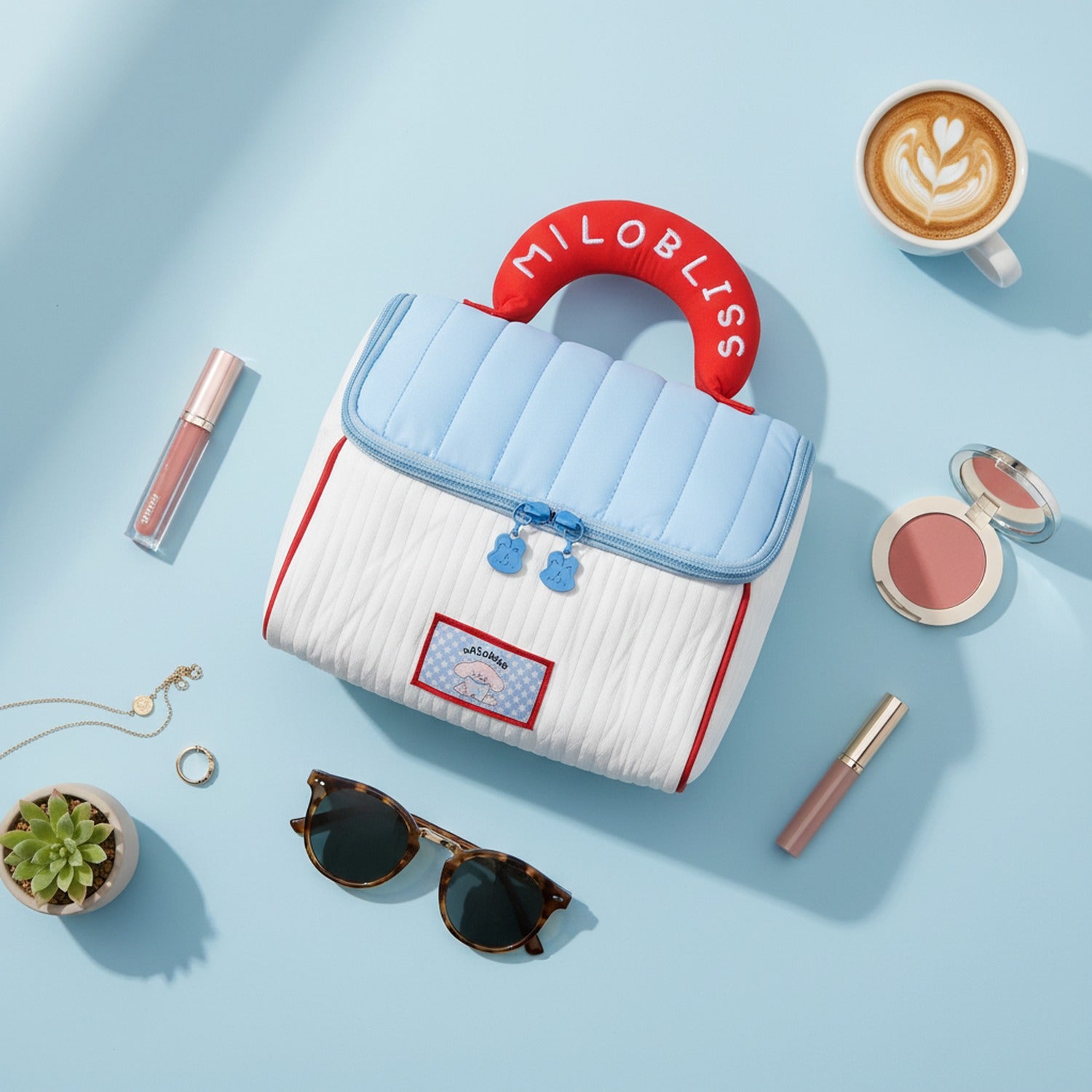 Blue And Cream Quilted Cosmetic Bag With Red Handle