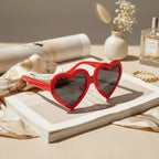 Red Heart-Shaped Sunglasses With Dark Lenses
