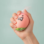 Pink Lychee Squishy With Smiling Face Charm - squeeze in hand