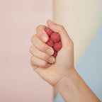 Sweet Sugar Coated Fruit Spheres - squeeze in hand