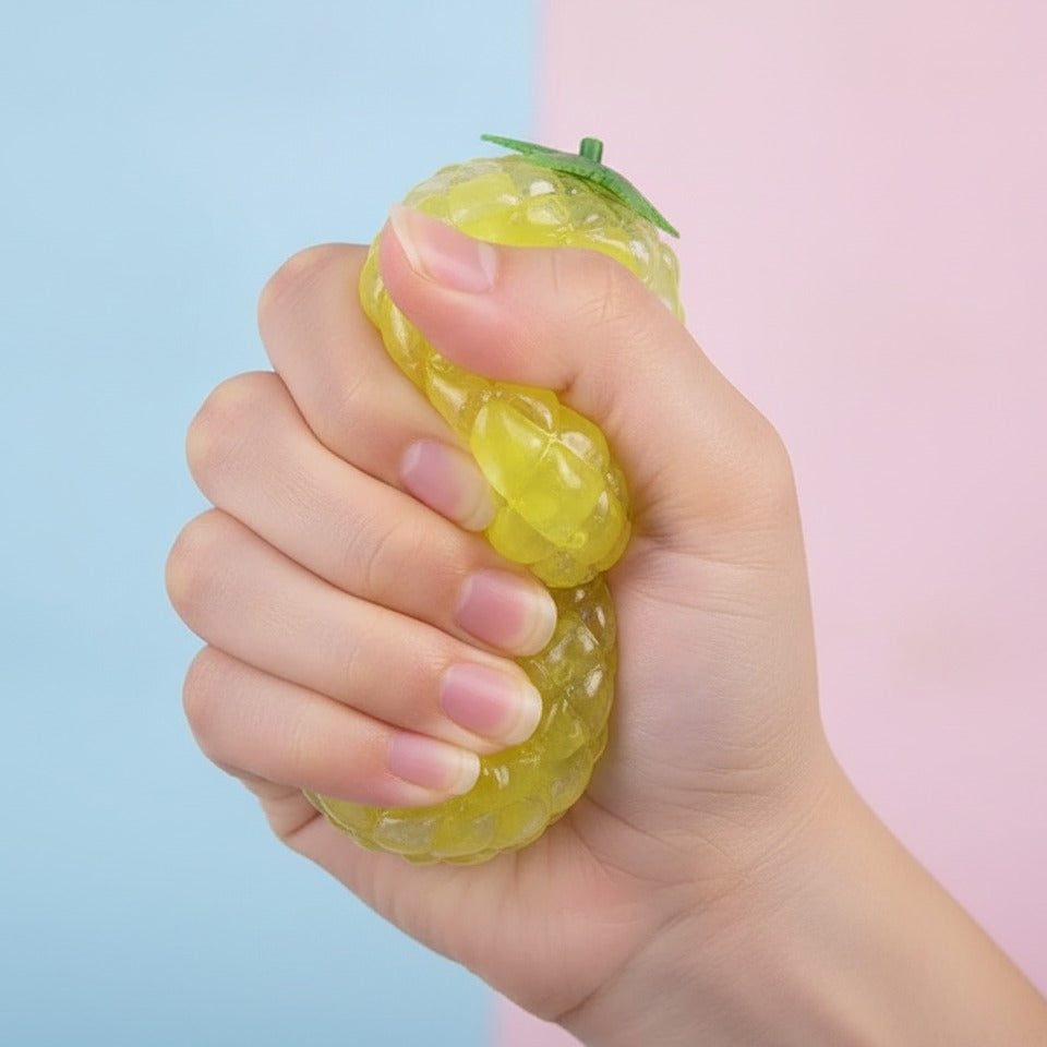 Squishy Fruit Balls With Leaf Charms - squeeze in hand