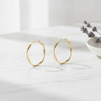Twisted Oval Hoop Earrings - Gold