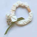 Cream Scrunchie With Pearl And Charm Detail – hair accessories (view 1)