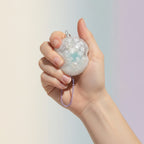 Winter Wonderland Glitter Sphere Ornament - squeeze in hand