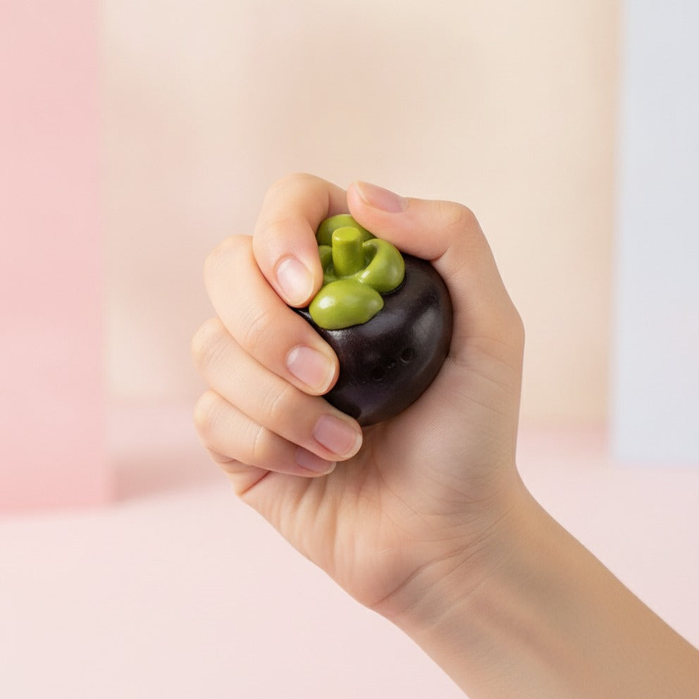 Purple Mangosteen Fruit Miniature Figurine - squeeze in hand