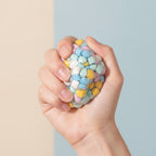 Pastel Bubble Pop Squishy Ball - Pastel Rainbow - squeeze in hand