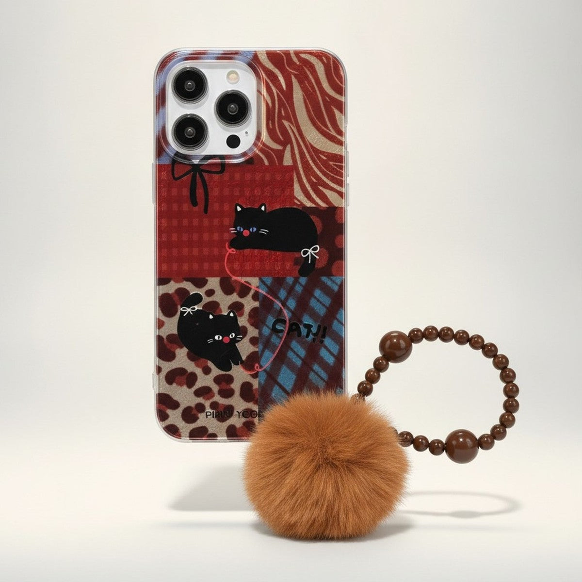 Brown Cat Patchwork iPhone Case with Pompom Strap – tech (view 1)