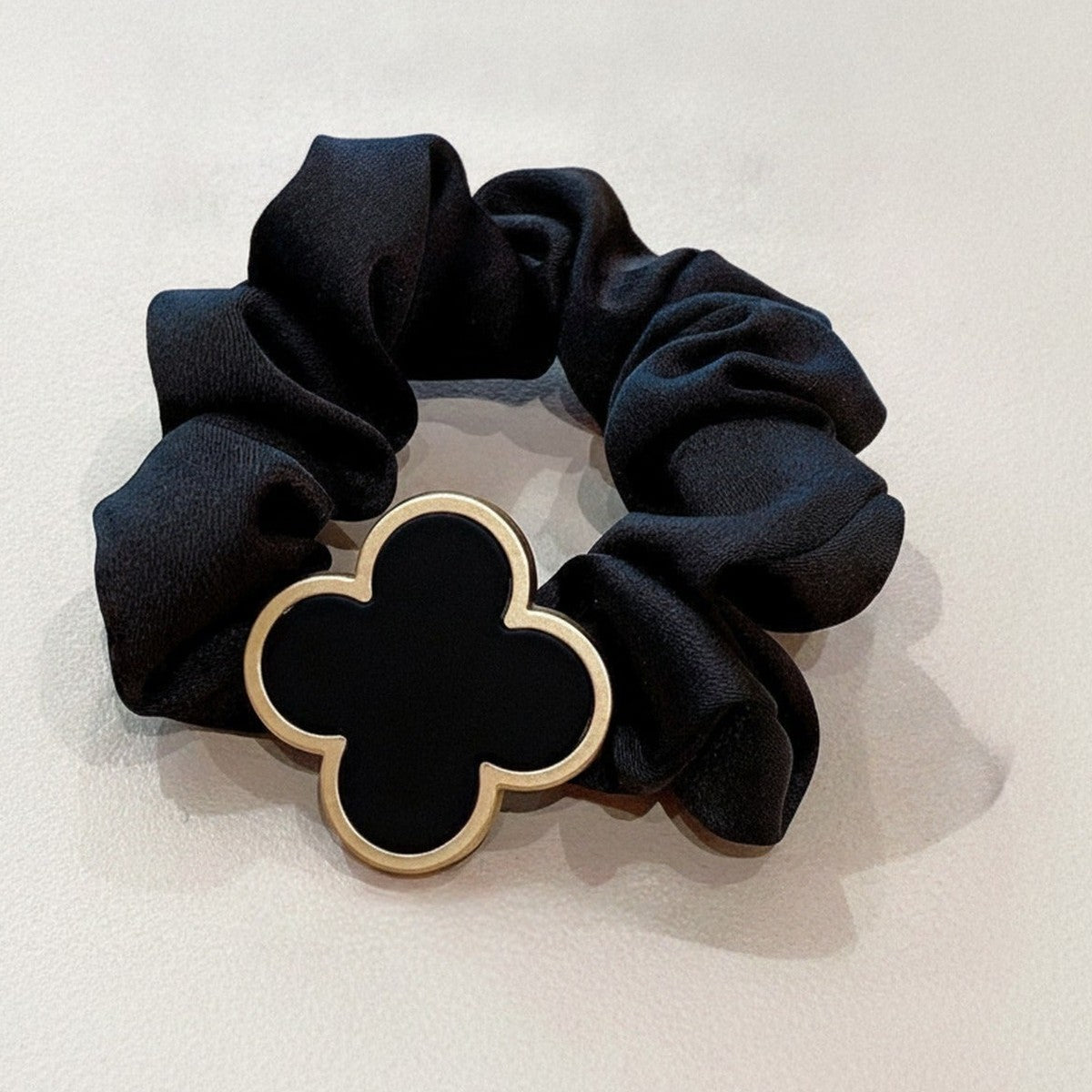Black Scrunchie With Gold Clover Charm – hair accessories (view 1)