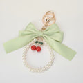 Elegant Bow Cherry Pearl Keychain – apparel accessories (view 1)