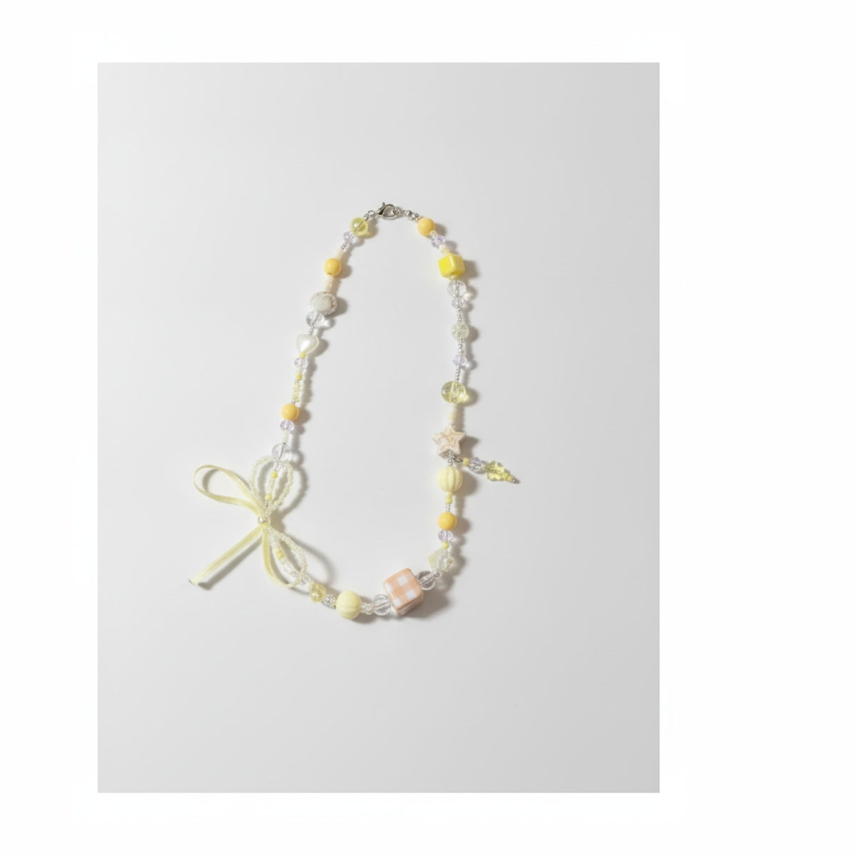 Yellow & White Star Beaded Charm With Bow – jewelry (view 1)