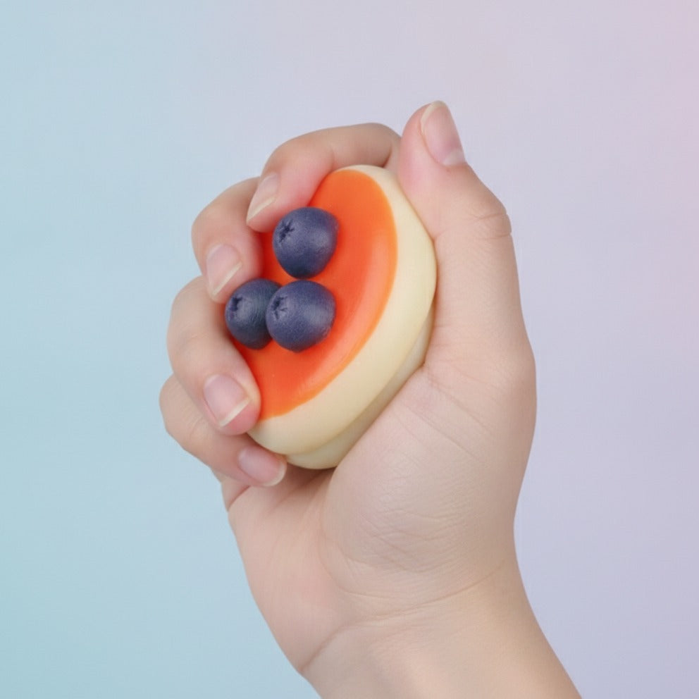 Mini Blueberry Pudding Dessert Magnet - squeeze in hand