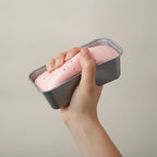 Sanrio Hello Kitty My Melody Strawberry Cake Tin - squeeze in hand