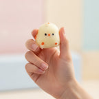 Clear Bagged Cream Chick Squishy Toy - squeeze in hand