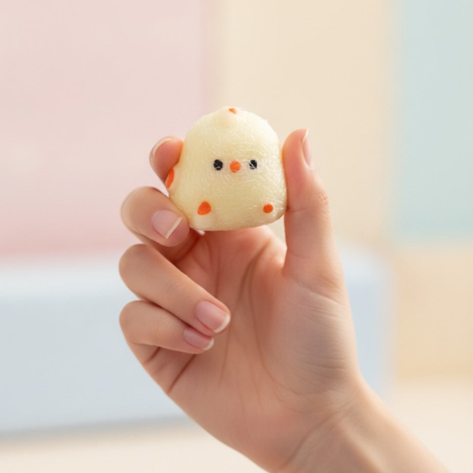 Clear Bagged Cream Chick Squishy Toy - squeeze in hand