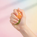 Fruit Smoothie Squishy Ball - Passion Fruit - squeeze in hand
