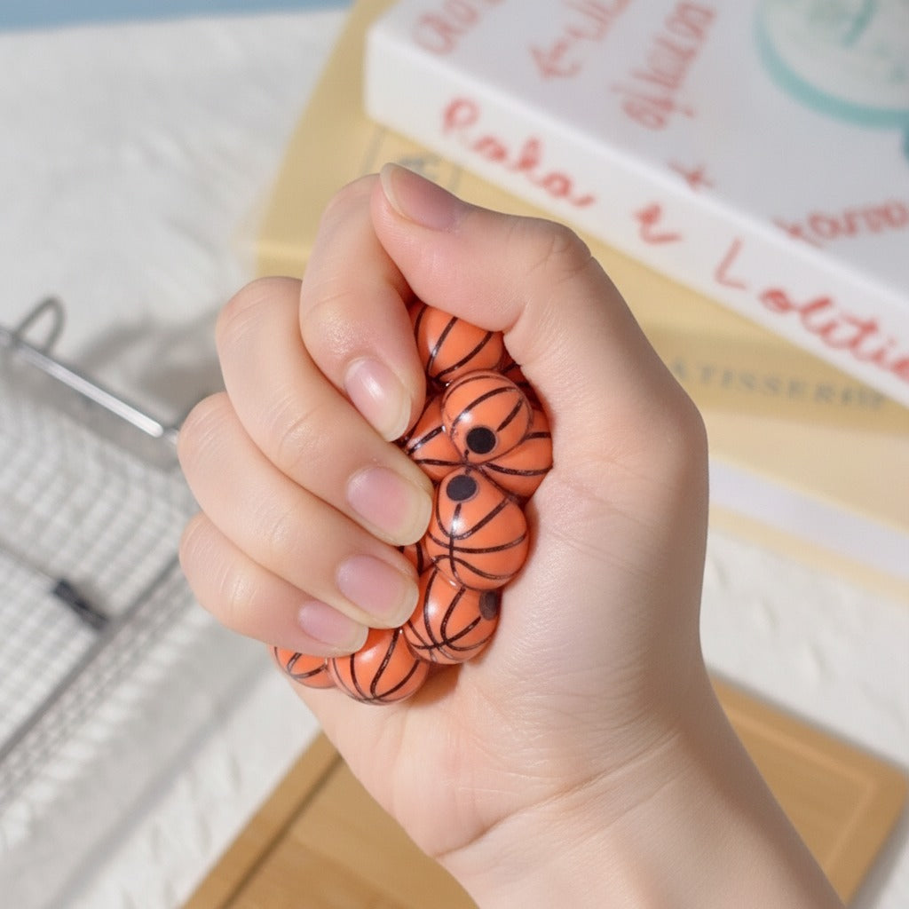 Basketball Bubble Pop Squishy - squeeze in hand