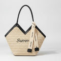 Beige Straw Tote Bag With Black Handles And Ribbon Charm – bags & wallets (view 1)