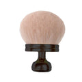 Use large mushroom-shaped powder and blush brushes more often. - Black