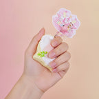 Peach Toast Squishy Keychain - squeeze in hand