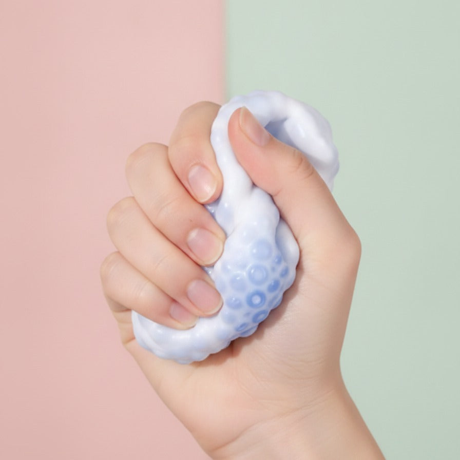 Mochi Skin Stress Relief Ball - squeeze in hand
