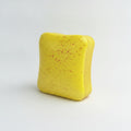 Butter toast squishy yellow with red speckles - front