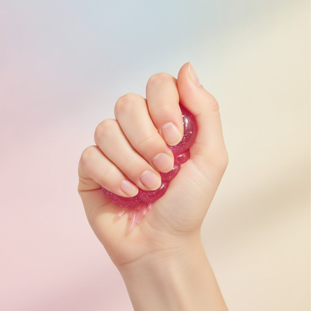 Pink Glitter Jellyfish Stress Ball Toy - squeeze in hand