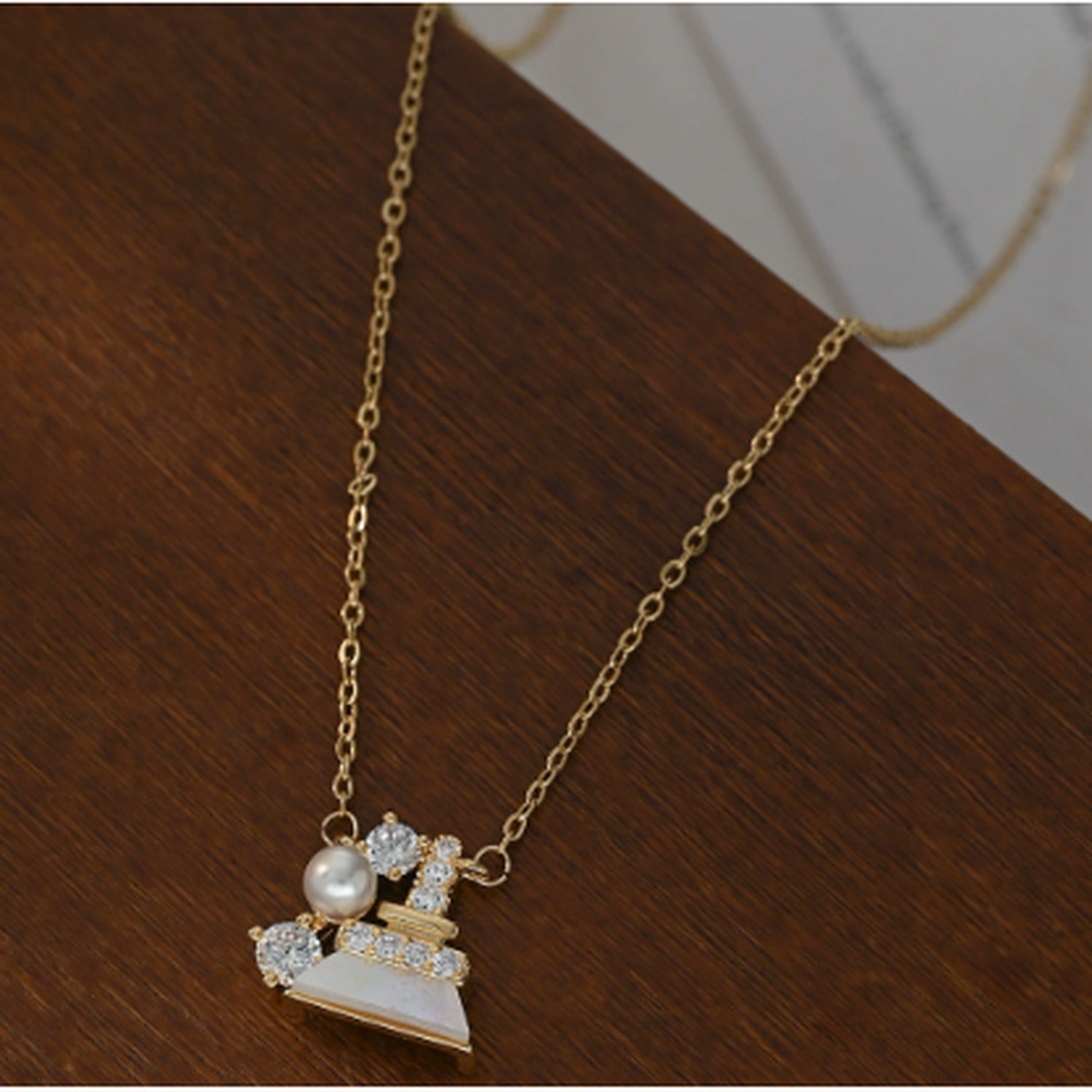 Pearl and Rhinestone Bell Charm Necklace - Gold XL70298