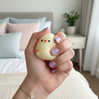 Cream Chick Squishy with Orange Details
