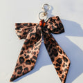 Leopard Print Acrylic Keyring With Bow Charm - Yellow Leopard Print