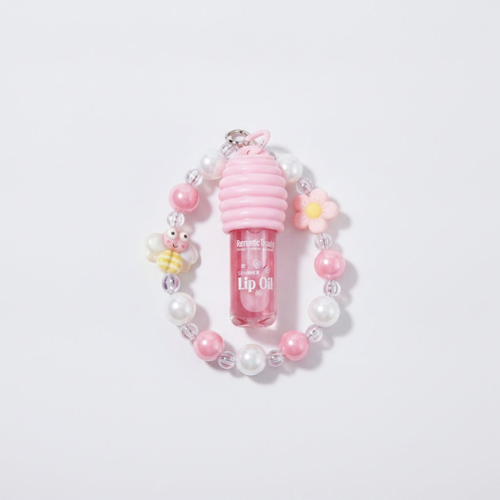 Pink Beaded Lip Oil Keychain With Flower Charm – Korean beauty tool (view 1)