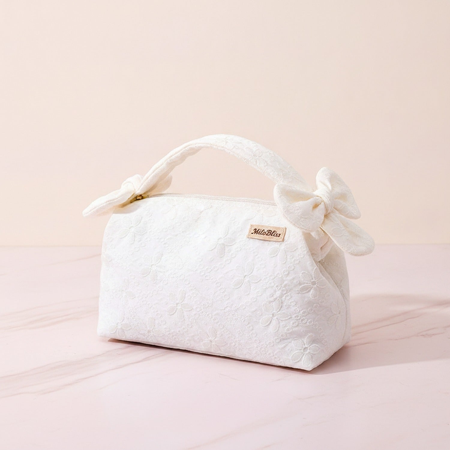 Quilted Cream Cosmetic Bag With Bow Handles