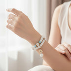 White Beaded Bracelet With Aqua Charm