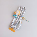 Rope Phone Charm With Doll And Tassel – tech (view 1)